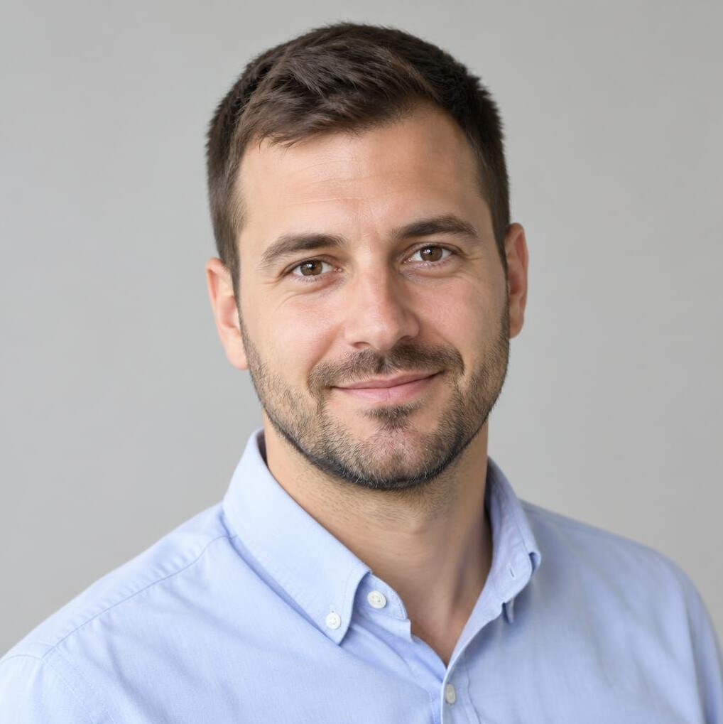 Portrait of a man with a light beard in a casual shirt